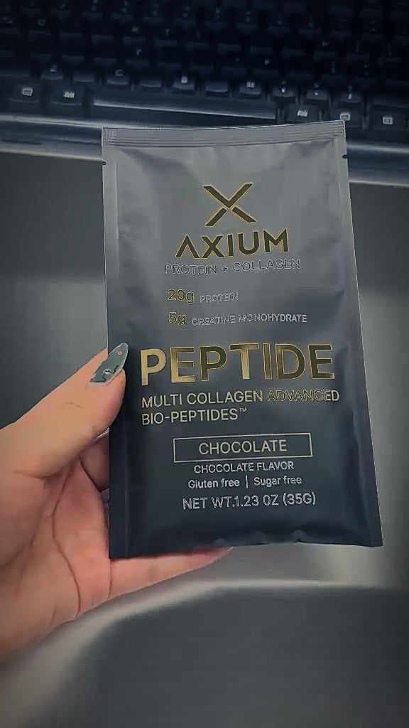 AXIUM sachet in hand